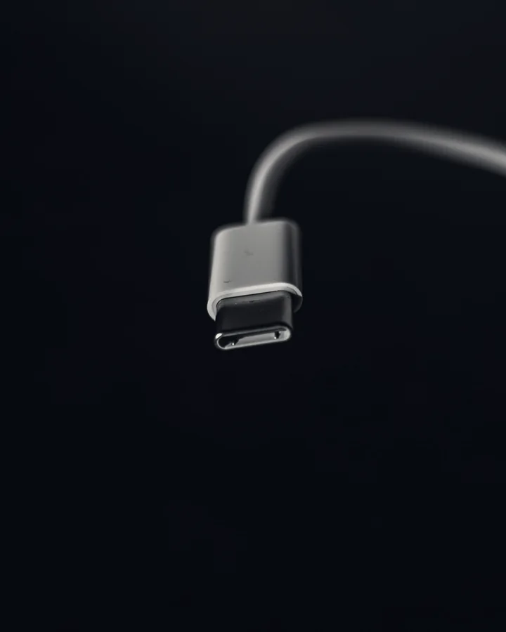 A USB cable against a dark background.
